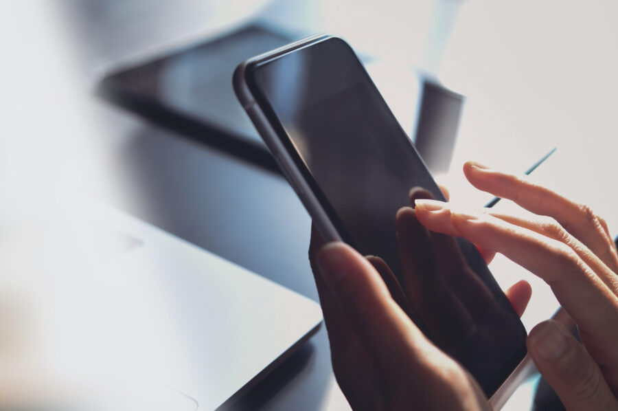Close-up, business woman using smartphone, touching on screen, s